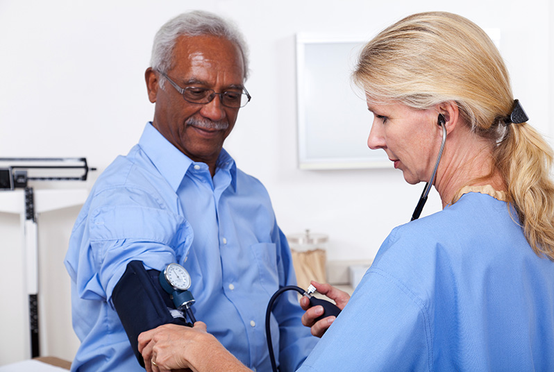 Male patient getting his blood pressure checked